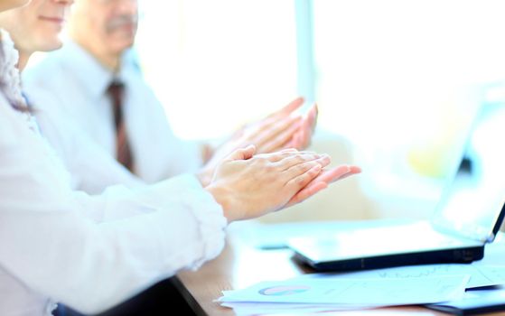 Photo of business partners hands applauding at meeting