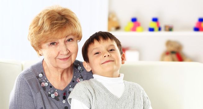 Grandson with his grandparents in the living room