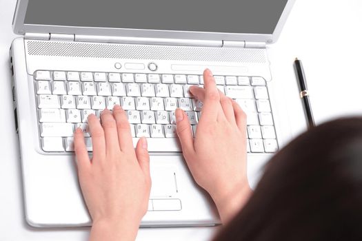 closeup.young woman typing text on laptop keyboard.people and technology