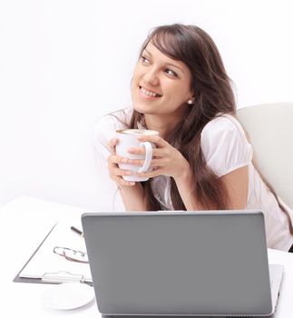 closeup.young woman with Cup of tea sitting in the workplace.isolated on white