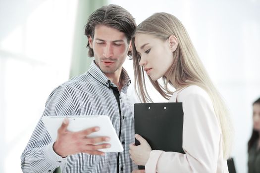 Office workers looking at tablet computer. closeup.