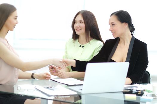 handshake of business partners at your Desk.woman and business.