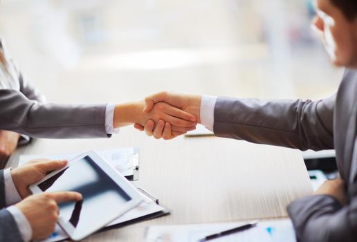 Business people shaking hands, finishing up a meeting