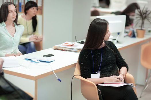 rear view.modern business woman sitting in office.successful business people