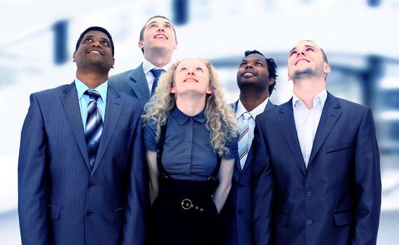 A group of business people in the office. Look to the top.