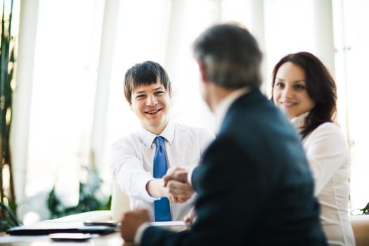 A group of businessmen discussing the policy of the company in the office.