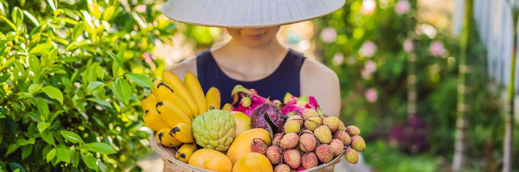 Variety of fruits in a Vietnamese hat. Woman in a Vietnamese hat. BANNER, LONG FORMAT