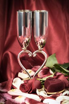 wedding wine glasses and a box with a ring on a festive background. photo with copy space