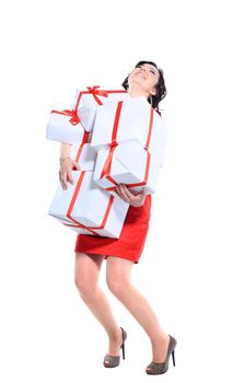 Excited attractive woman with many gift boxes and bags.