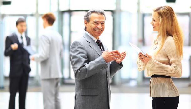 Business people using a digital tablet