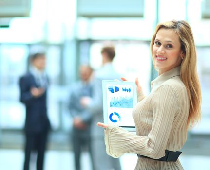 Handsome businesswoman using his digital tablet