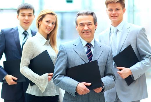 Group portrait of a professional business team looking confidently at camera