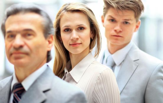 Group portrait of a professional business team looking confidently at camera