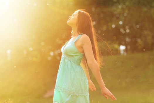 Beauty Girl Outdoors enjoying nature