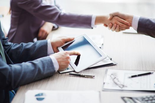 A group of businessmen discussing the policy of the company in the office.