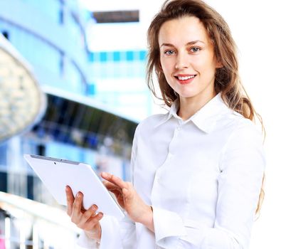 Business lady with positive look and cheerful smile posing for the camera