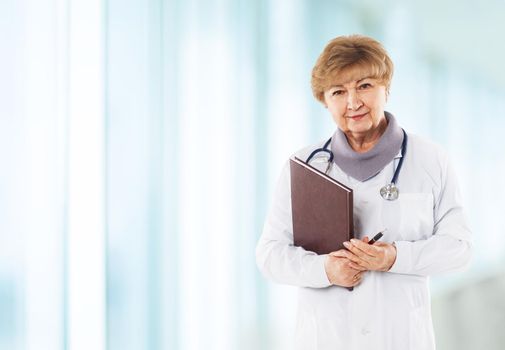Medical physician doctor woman over blue clinic background
