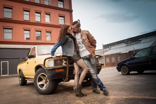 Beautiful sexy young couple walking on city streets.