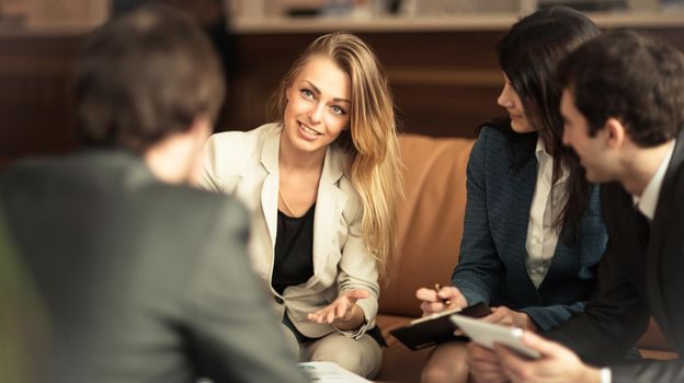 A group of successful businessmen. Discussion of the important contract of the company.