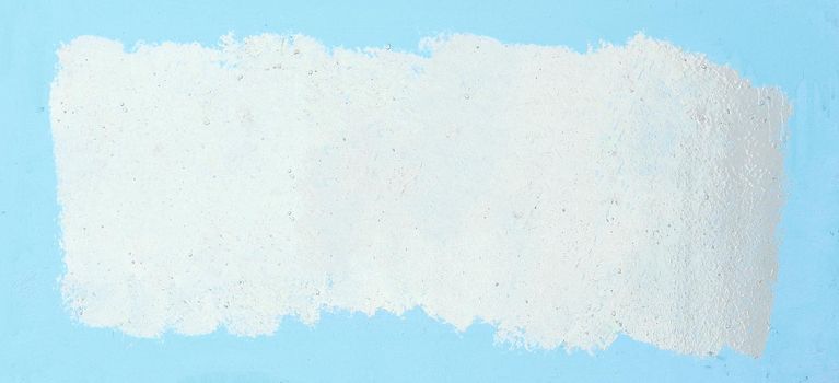 painted white frame on a blue background. photo with copy space.