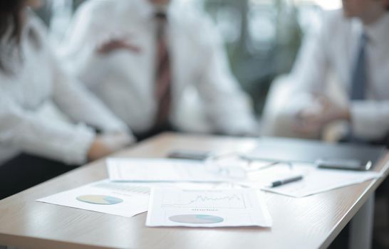 background image. closeup of a table with documents and business team.business background