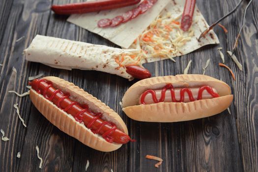 fast food.hot dogs and Shawarma on wooden background.