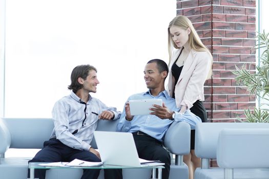 business team reading text on a digital tablet .photo with place for text