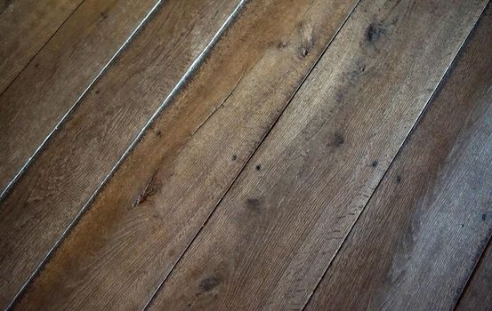 An old wooden floor with diagonal planks. Intended as an alternative background
