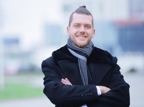 closeup.portrait of a successful man on blurred background city.