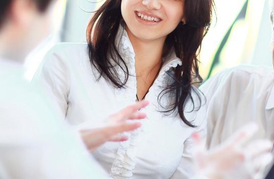 closeup. business team talking while sitting at your Desk in the office