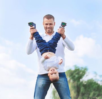 happy father and son on a walk on a Sunny day