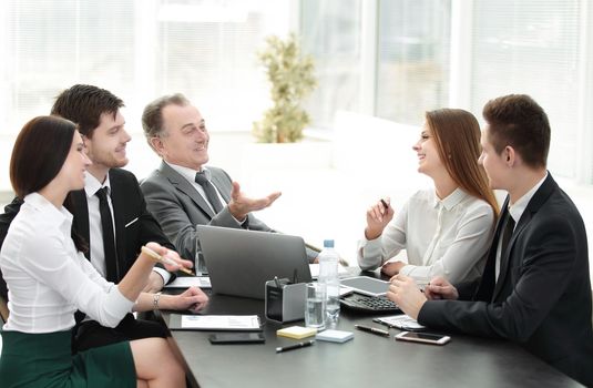 business colleagues talking at Desk in the office.the concept of teamwork