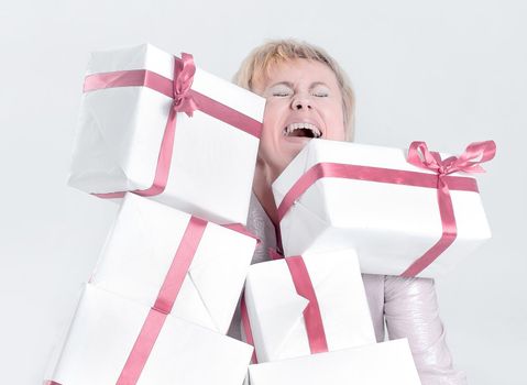 closeup of woman with lots of gift boxes.isolated on a white background.