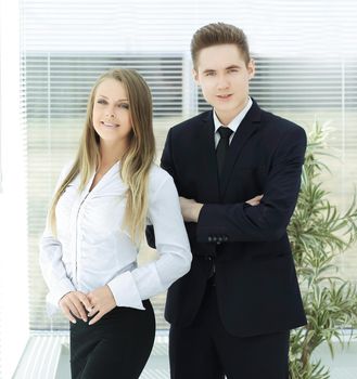 business couple standing in a modern office.photo with copy space