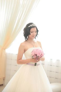 young bride with a bouquet of roses. photo with copy space
