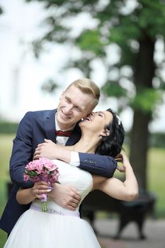 Bride and groom at wedding Day walking Outdoors.Bridal couple,