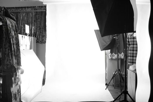 background image of Empty photo Studio with lighting equipment.