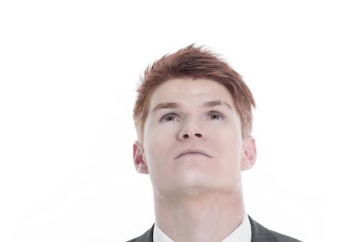 closeup.young man looking up at copy space.isolated on a white background.