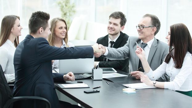 business partners shaking hands after a successful transaction.concept of partnership