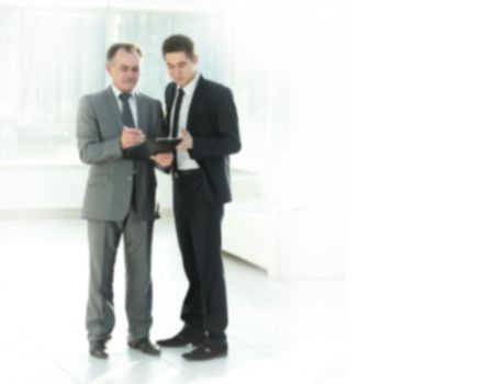 Businessman showing a document to his colleague.photo with copy space