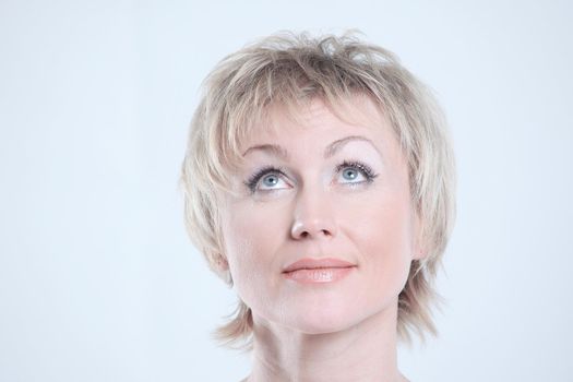 closeup of a beautiful woman with day makeup looking at copy space.