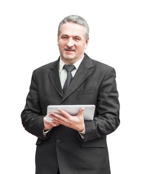 businessman with digital tablet stands on the background of a modern office building