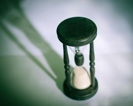 hourglass on dark background.the concept of time.photo with copy space