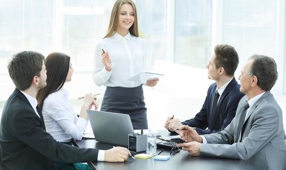 young business woman makes a report on the working meeting in the office.photo with copy space