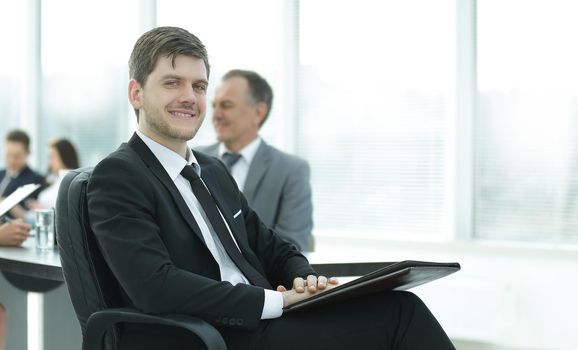 business man at office with his business team working behind.photo with place for text