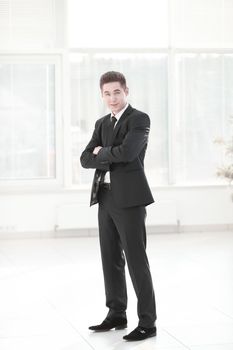 confident businessman standing in the spacious lobby.photo with place for text