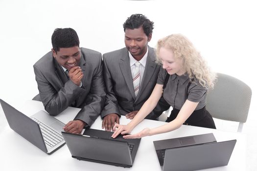 successful business team discussing the information with the laptop .isolated on white