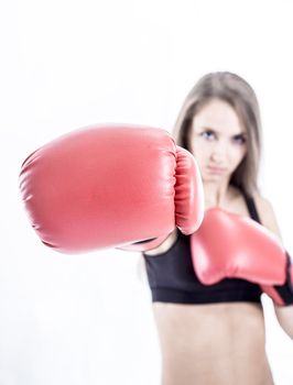 sporty woman in red Boxing gloves.a healthy way of life.beauty and sport.the photo has a blank for text