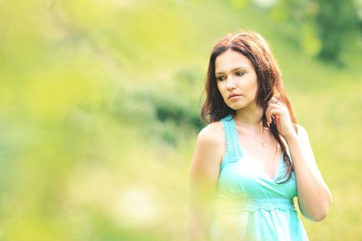 beautiful young woman on field