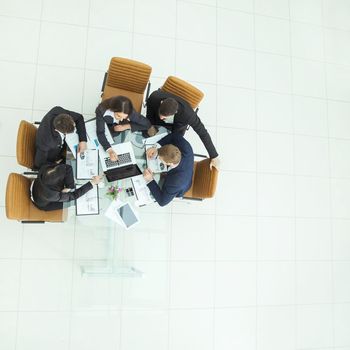 top view of successful business team working on a financial report on the company's profits.the photo has a empty space for your text